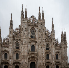 Fototapeta na wymiar Architectural details of Gothic cathedral church in Milan, tourist attraction in northern Italy