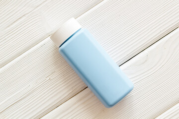 Spilled baby talcum powder. Container with powder for baby body care
