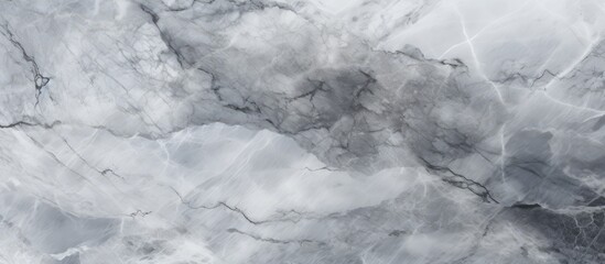 Naklejka premium A close up of a gray marble texture with a cloudy sky in the background, capturing the contrast between the smooth rock and the fluffy cumulus clouds in freezing weather