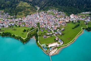 Auronzo, Italy - The beautiful turquoise lake and the village of Auronzo in the Dolomite mountains