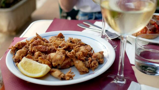 Chipirones, fried squid with lemon tapa in Spain	
