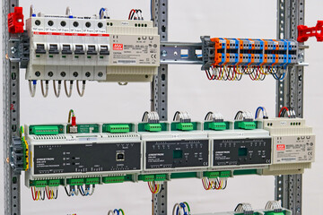 The electronic module for automatic control is installed in an electrical distribution cabinet.