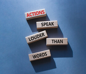 Actions speak louder than Words symbol. Wooden blocks with words Actions speak louder than Words. Beautiful grey background. Business and Actions concept. Copy space.