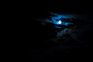 Blue moon in clouds
