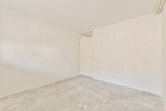 Empty room ready for renovation with textured floor