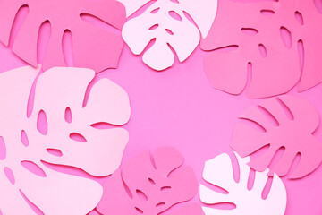 Composition with different paper leaves on pink background