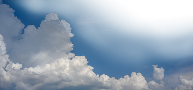 PNG of a dramatic cumulus cloud in a blue sky. The sky fades to transparent towards the upper right corner.  
