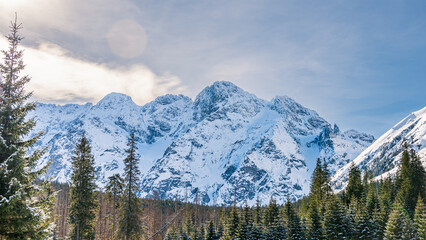 Snow-covered mountain peaks. Winter in the mountains. Polish mountains.
