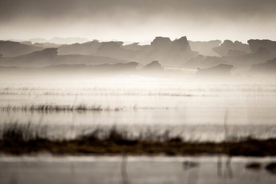 Mist-shrouded Icelandic landscape in grayscale