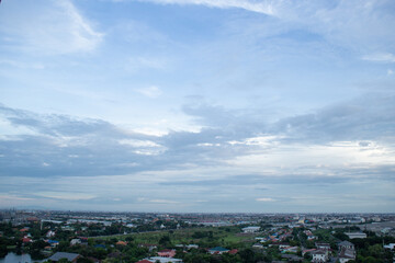 heaven cloudy sky day evening dusk time with sunlight ray from between clouds with city town background