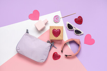 Composition with stylish female accessories, gift box and decor on color background