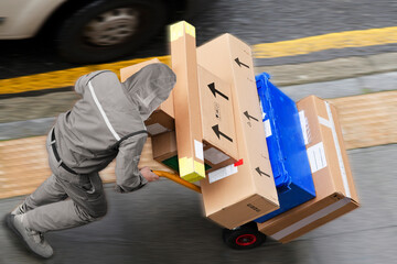 delivery courier worker with packages boxes with boxcar for delivering in city - 770022471