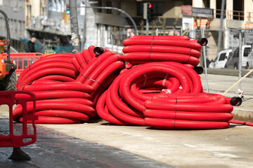 red corrugated pipes for  water or communications or sewer for install  in construction site on street city - 770022473