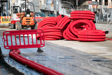 red corrugated pipes for  water or communications or sewer for install  in construction site on street city - 770022478