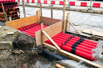 red corrugated pipes for  water or communications or sewer for install  in construction site on street city - 770022612