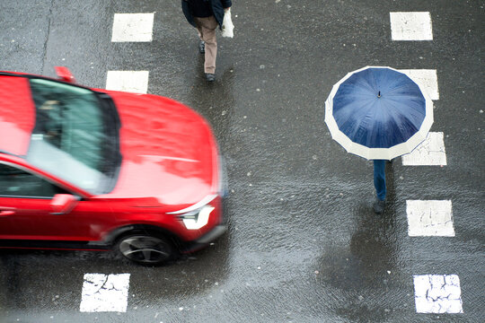 people pedestrian  in dangerous situation in crosswalk in city street by vehicles at high speed