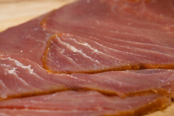 thin slices of Smoked tuna macro food background - 770024299