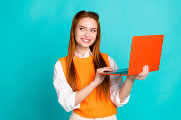 Photo of cute adorable lovely woman wear stylish orange clothes hold wireless netbook look empty...