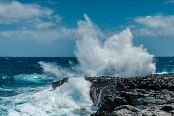 Makapuʻu Tide Pools, basalt comes from the Koʻolau volcano in eastern Oahu, Hawaii Geology. Waves hitting the rocks. 
