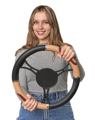 Caucasian blonde with steering wheel, playfully mimicking driving .