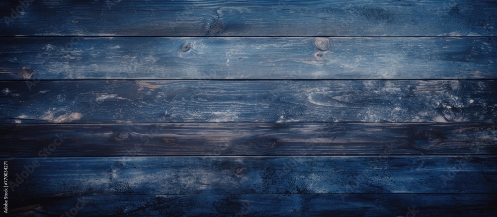Aufkleber an electric blue liquid pattern resembling flowing water on a dark wooden surface, creating a mesmer