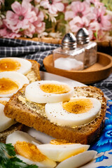 Whole wheat sandwich with boiled eggs.