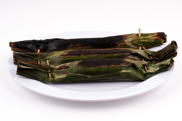 Pulut Panggang or grilled glutinous rice on white background