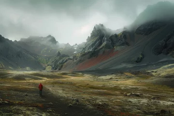Papier Peint photo autocollant Vinicunca person walking through an area with mountain landscapes