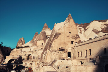 Cave dwelling carved in limestone rock formations. Fairy chimney at Cappadocia. Rock hoodoo in...
