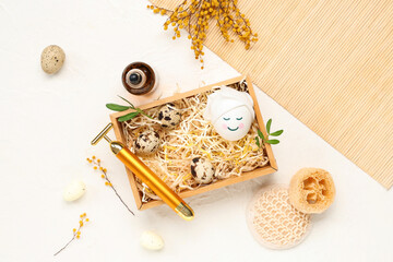 Beautiful spa composition with Easter eggs on light background