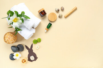 Composition with spa accessories, flowers and Easter decor on color background © Pixel-Shot
