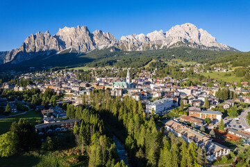 Cortina d'Ampezzo, Italy - Aerial view of the beautiful Italian village in the Dolomite mountains, host of the 2026 Olympics - obrazy, fototapety, plakaty