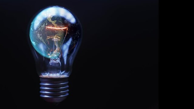 A flashing electric lamp inside which the planet earth rotates on a black background. The concept of actualizing the salvation of the planet. Cg