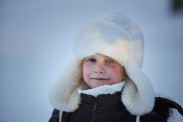 Young Girl in White Hat and Black Jacket