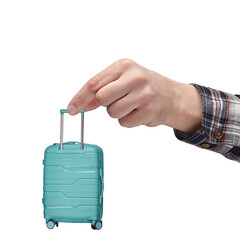 luggage and hand luggage, a miniature mint-colored suitcase on a white isolated background in the hand, the concept of a limit on the weight of baggage carried in airlines