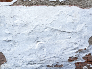 Close-up of a white old cracked wall