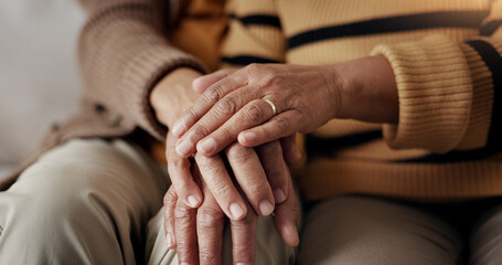 Senior, couple and hands for empathy on sofa with support, grief and comfort in living room of...