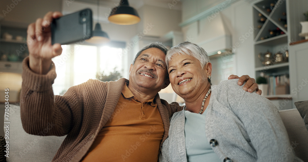 Canvas Prints Senior couple, home and selfie while laughing on sofa and enjoying retirement together. Phone, smile and happy pensioners in family house, embracing each other and playful energy as elderly people