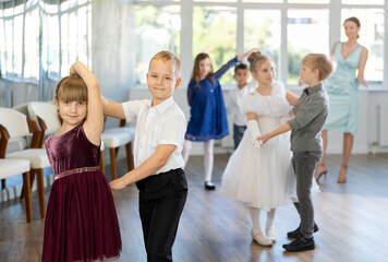 Classical dances performed by preteen children in beautiful festive clothes