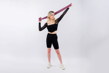 Photo of woman workout with resistance band. Strength and motivation.