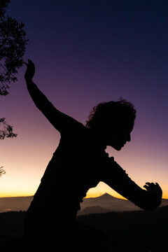Silhouette of a dancer at sunset