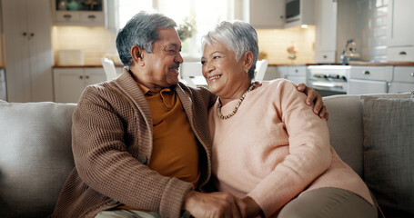 Senior couple, face and hug on couch, smile and bonding with love, support and relax in retirement...