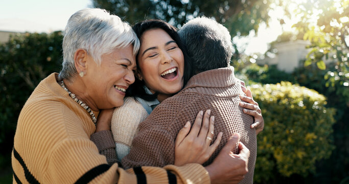Mexican family, hug and smile for reunion, outdoors and love for support, retirement and care. Elderly parents and daughter, visit and happy in backyard, bonding and embrace for quality time at home - Powered by Adobe