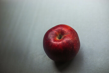 red apple on wooden background