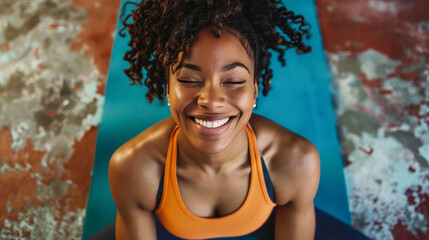 Happy woman doing muscle exercises on yoga mat.