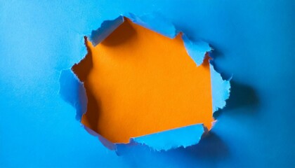 Vibrant blue torn paper. Burst orange background. Minimal abstract colorful wallpaper concept