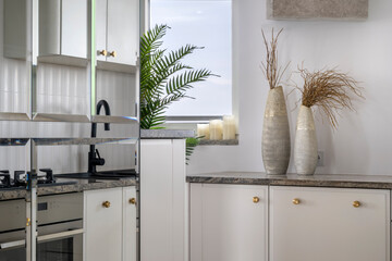 Detail of stylish interior white kitchen