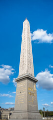 The Luxor Obelisk stands tall against a clear blue sky in Paris Place de la Concorde. France