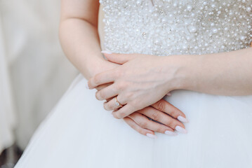 bride hands with engagement ring