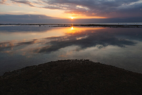 Tranquil sunset over Indonesian coastal waters